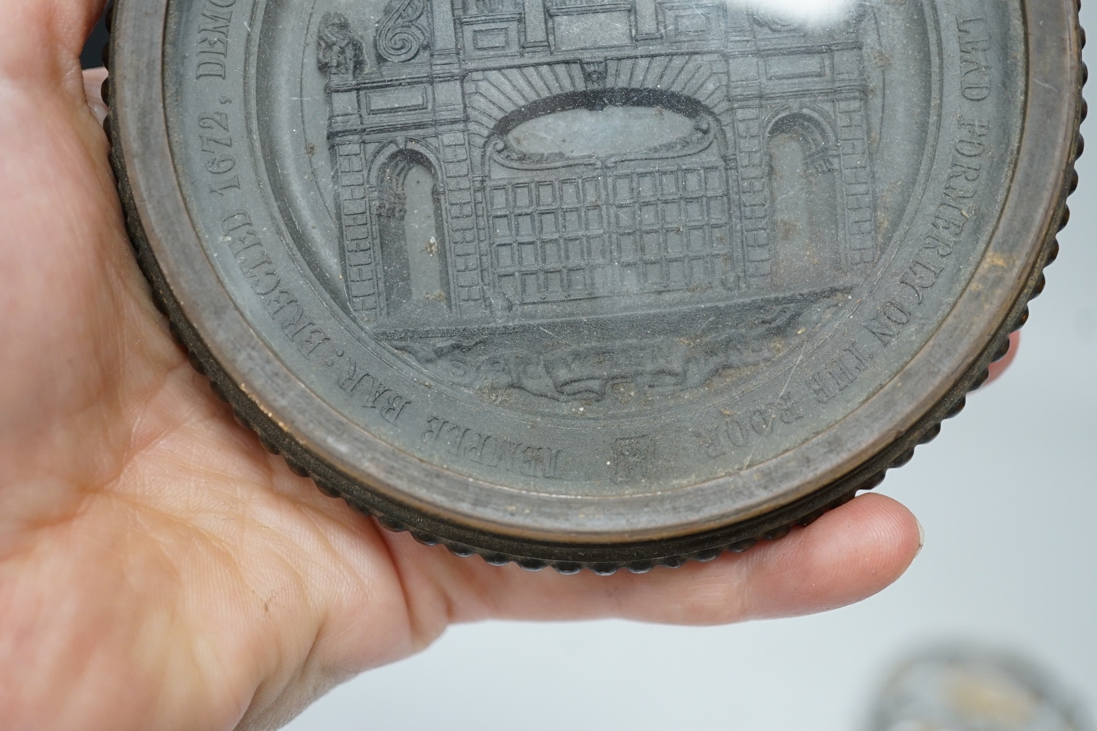 Temple Bar commemorative cast lead and brass paperweight, ‘Temple Bar: erected 1672, demolished 1878; this effigy of it was struck from the lead formally on the roof’ and a 19th century gilt metal relief glass cased pape